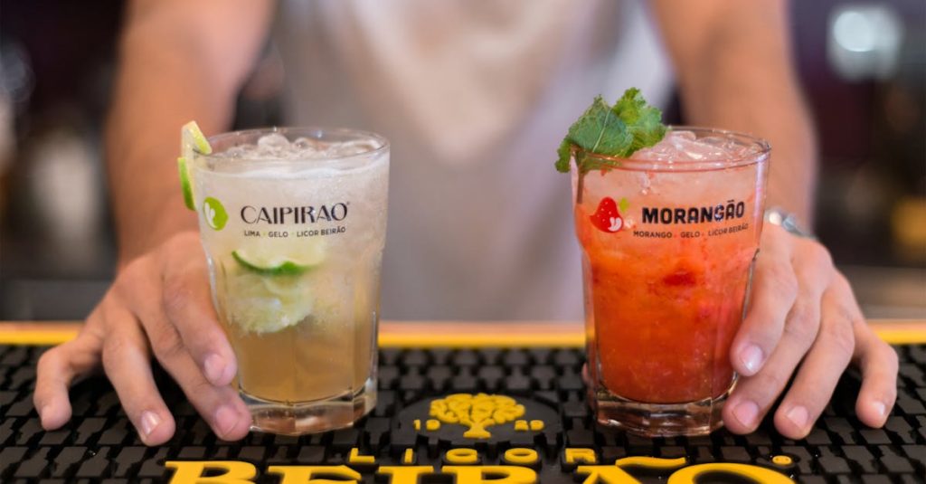 Close-up of refreshing cocktails with mint and lime at a bar in Porto, ideal for summer parties.